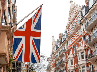 Fototapeta na wymiar union jack flag ,national symbol on building on London's street