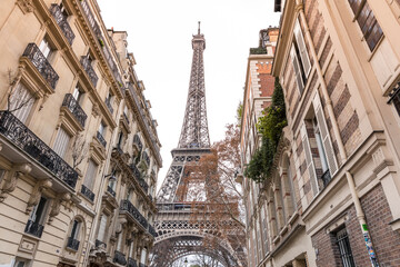 Eiffel Tower in Paris between buildings