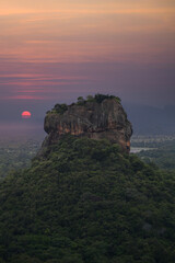 Sundown with view from Pidurangala mountain to Sigiriya Lion Rock in Sri Lanka. Landscape panorama....