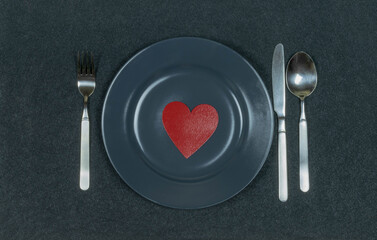 LOVE Red heart on a gray plate. Black detailed background.
What's on your plate? LOVE! Beautiful St. Valentine's card. Nice copy space.