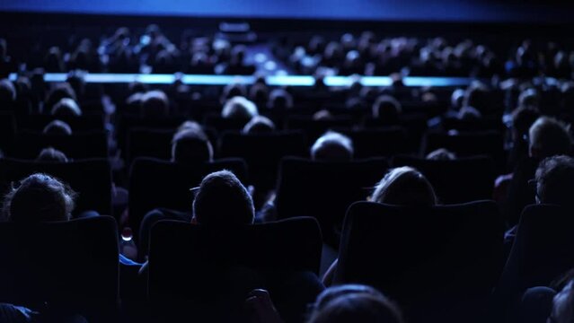 Large crowd of people in a cinema - film performance in a movie theater