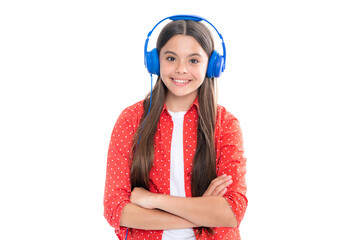 Young teen child listening music with headphones. Girl listening songs via wireless headphones. Wireless headset device accessory. Portrait of happy smiling teenage child girl.
