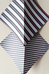 folded scrapbook paper sheets with stripe patterns