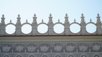 Fototapeta premium castle decoration elements. Gothic arches against the background of the sky. Elements of architecture, ancient arches, columns, windows and openings