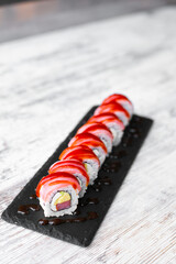 light salmon cheese sushi philadelphia on black desk white background