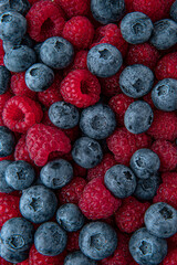 Berry mix of blueberries and raspberries. Fresh, ripe, juicy berry. Macro selective focus.