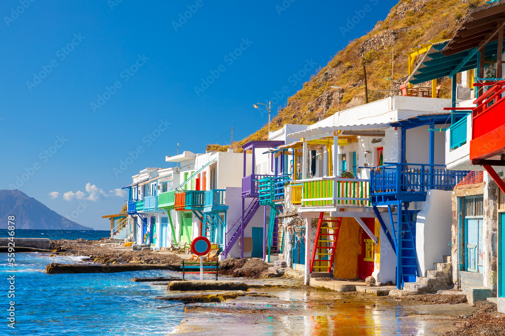 Wall mural vibrant fishing village of klima with white houses and colorful doors on milos island in greece