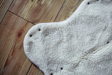 Fototapeta premium Detailed photo of a original sheep wool handmuff