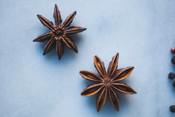 Overhead view of star anises on marble