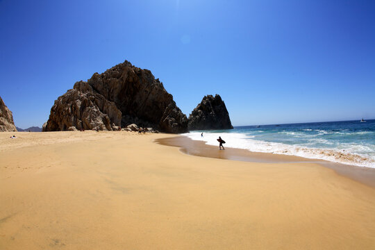 Skimboarders play at Divorce Beach near El Arco in Cabo San Lucas in Baja, Mexico.