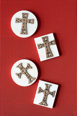 wood crosses on wooden shapes and corrugated paper