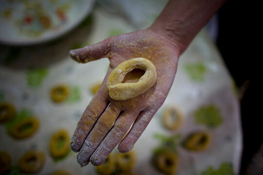 A woman cooks a culin for desert in a home in Prado del Rey village, Cadiz province, Andalusia, Spain.