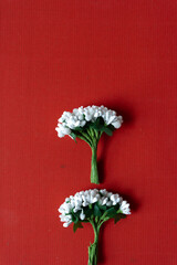 bunch of faux nosegay flowers on red paper