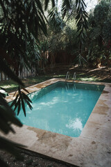 Beautiful bright turqouise swimming pool in private setting