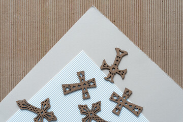 set of wood crosses on paper