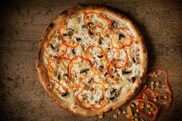 delicious pizza with mushroom, pineapple, corn and sweet pepper paprica top view