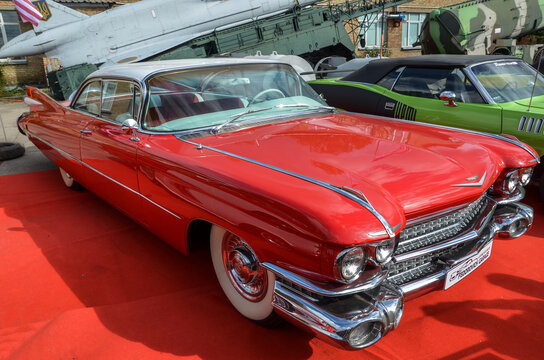 Vintage luxury red car Cadillac DeVille 1959 is presented at the "Old Car Land" retro car festival in Kyiv