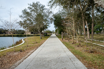 Fototapeta na wymiar Concrete walking path at the grounds of the Mission Nombre de Dios in St. Augustine, Florida
