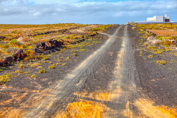 Country road in desert . Cottage at dessert area . Mexican arid landscape