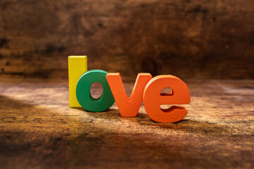 Word love, written with colour wood material