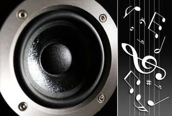 Audio speaker, music notes and other musical symbols on dark background, closeup