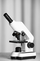 Modern microscope on table indoors. Medical equipment