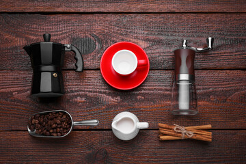 Flat lay composition with manual grinder and geyser coffee maker on wooden background - Powered by Adobe