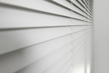 Closeup view of horizontal blinds on window indoors