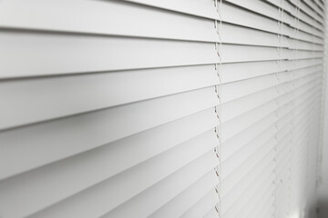Closeup view of horizontal blinds on window indoors