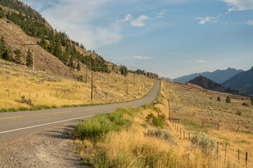 A Canadian highway through the British Columbia Caribou region on a sunny day.  Near Lillooet BC, Canada.