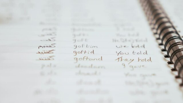 Learning Persian (Farsi) verbs in organised notebook