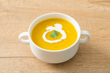 pumpkin soup in white bowl