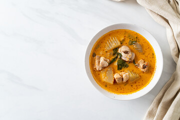 Chicken curry soup with roti