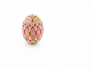 Pink, Red, and Lime Green Quill Art Easter Egg Against White Background