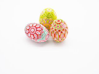 Three Quill Art Easter Eggs Against a White Background