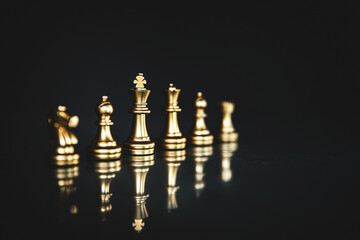 King chess pieces stand leader with team concepts of challenge or business teamwork volunteer or wining and leadership strategic plan and risk management or team player.