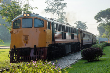 Obraz premium yellow classic train on railway in Thailand