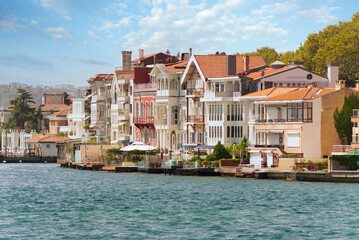Obraz premium View from the sea of the European side of Bosphorus strait, Istanbul, Turkey, with traditional houses, in a summer day