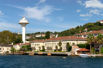 View from the sea of Saffet Pasa Mansion, or Saffet Pasa Mansion, and a white small radar, on background of the green mountains of the Europian side of Bosphorus, with dense trees, Istanbul, Turkey