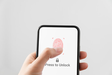 Hand using smartphone and press scan fingerprints to confirm your login, private data and prevent identity.