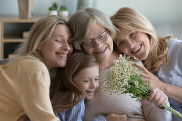 Happy different female generations family portrait. Grandkid woman, mature daughter, pretty cute...