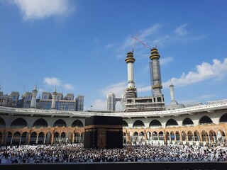 Fototapeta premium Beautiful interior view of Masjid al-Haram, Mecca, Saudi Arabia. Pilgrims from all over the world are performing Tawaf. 
