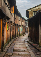 Narrow alley and historical Chinese townhouses in Wuzhen at dawn