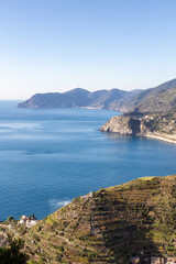 Small touristic town on the coast and farmland, Manarola, Italy. Cinque Terre. Sunny Fall Season day.