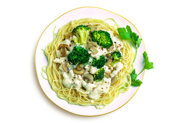 Traditional delicious italian pasta with cream sauce, broccoli, mushrooms and green olives on white plate isolated on white background. Close-up. Top dawn view. Flat lay composition.