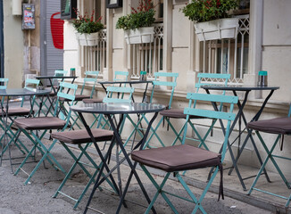 Table and chairs in an outdoor cafe.
