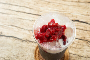 Strawberry latte in a takeaway cup