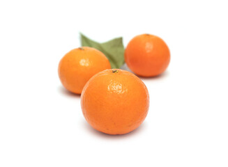 Ripe yellow tangerines on a white background.