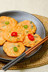Kimchijeon, Korean Kimchi Pancake food : Slices of well-fermented kimchi mixed into a flour batter and pan- fried. Finely chopped pork, squid, and clam meat may be added to the batter as well.