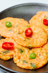 Kimchijeon, Korean Kimchi Pancake food : Slices of well-fermented kimchi mixed into a flour batter and pan- fried. Finely chopped pork, squid, and clam meat may be added to the batter as well.